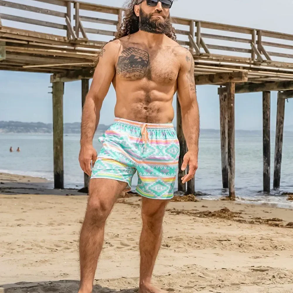 Chubbies | 'The En Fuegos' Classic Swim Trunk - size XXL in Teal Geometric